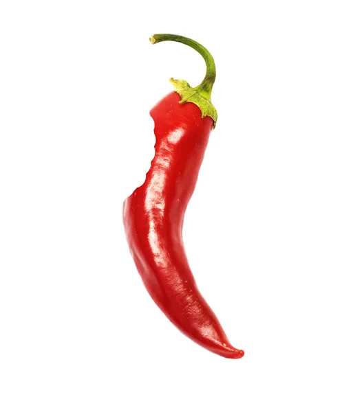 Bited uit een stuk van red hot chili peper — Stockfoto