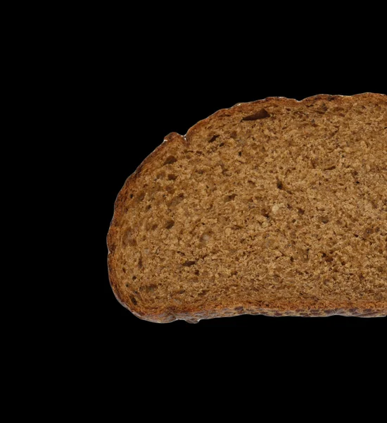 Rye bread on a black background — Stock Photo, Image