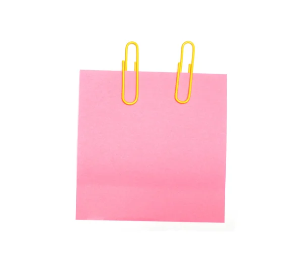 Pale pink sticker on yellow thumbtack. Isolated on white. — Stock Photo, Image