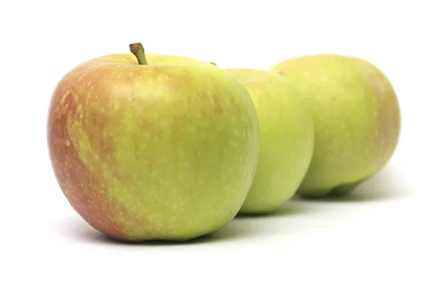 Fila di tre mele — Foto Stock