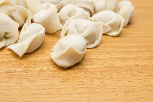 Homemade meat dumplings on a cutting board — Stock Photo, Image