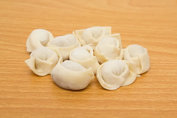Homemade meat dumplings on a cutting board — Stock Photo, Image