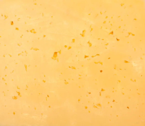 Fundo de queijo suíço amarelo fresco com furos — Fotografia de Stock