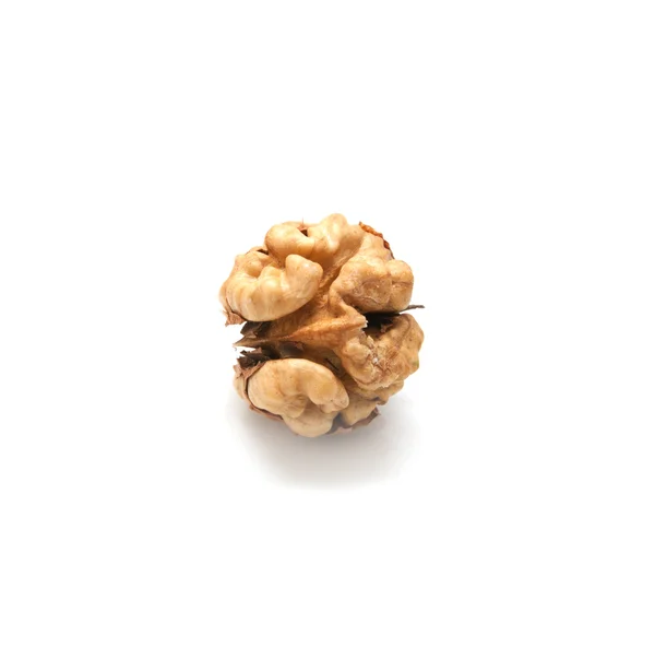 Раздавленные орехи на белом фоне — стоковое фото