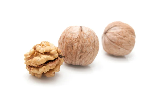 Crushed walnuts on white background — Stock Photo, Image