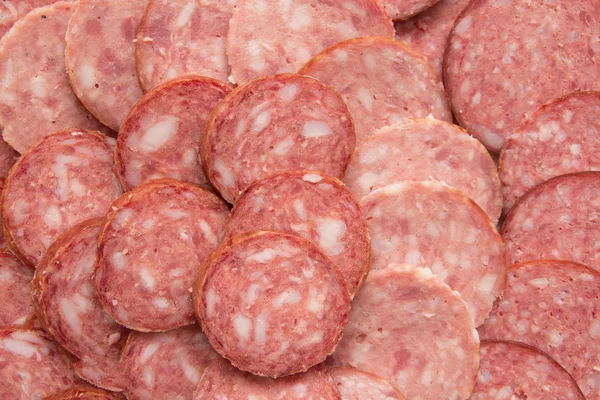 Sliced ​​sausage as background — Stock Photo, Image