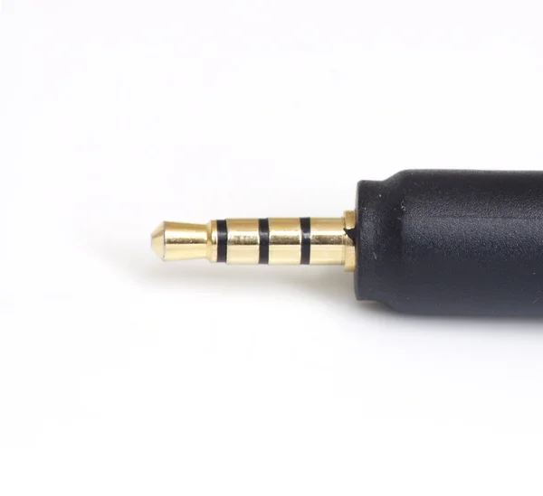Mini jack plug met roll van draad geïsoleerd op witte achtergrond — Stockfoto