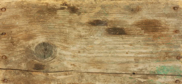 Sfondo del vecchio pezzo di legno con chiodi — Foto Stock