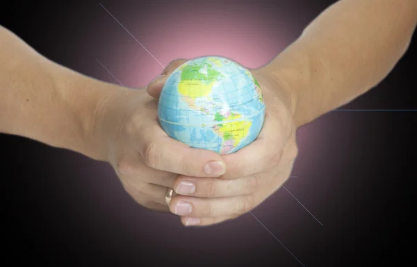 Man holding a glowing earth globe in his hands — Stock Photo, Image