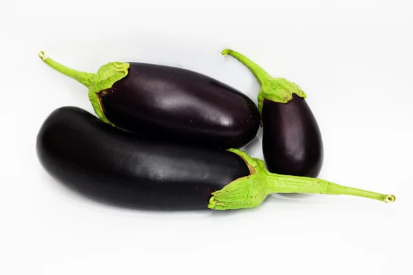 Three aubergine on white background — Stock Photo, Image