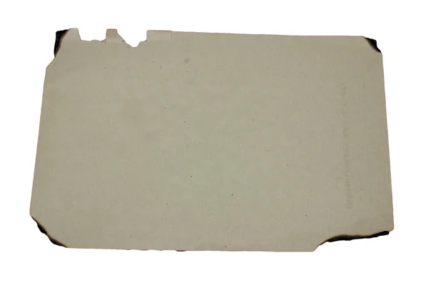 Um papel grunge velho isolado com borda queimada — Fotografia de Stock