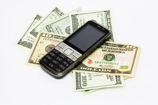 Close up phone on the money background Stock Photo