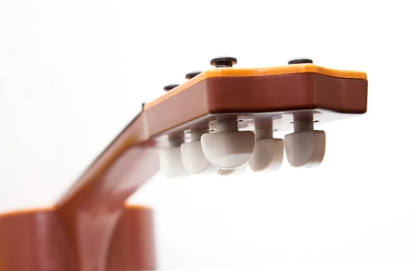 Guitarra sobre un fondo blanco — Foto de Stock