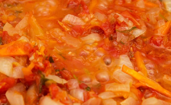 Tomaten en uien gebakken. achtergrond — Stockfoto