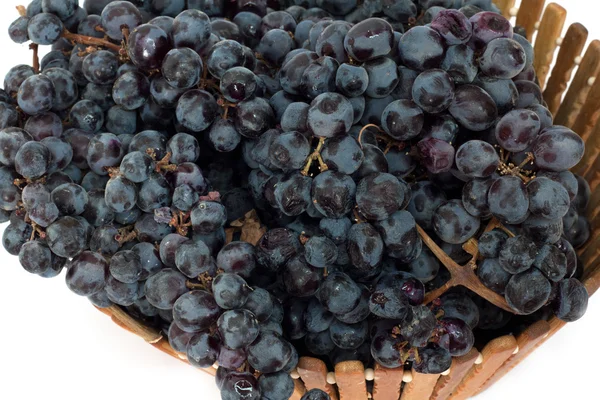Black grapes in a basket — Zdjęcie stockowe