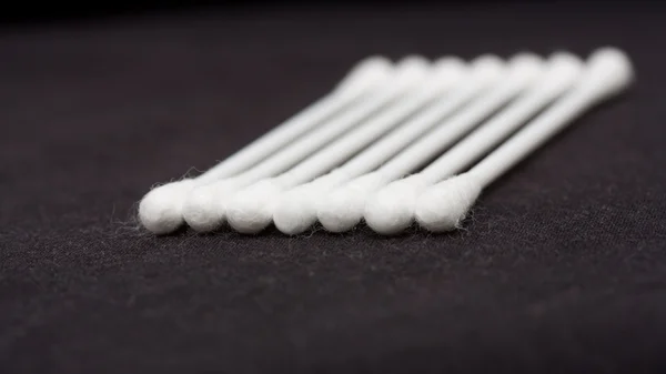 Cotton sticks isolated on black background — Stock Photo, Image