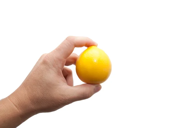 Limão em uma mão em um fundo branco — Fotografia de Stock