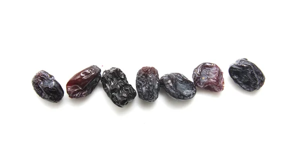 Black raisins set on white background. — Stock Photo, Image