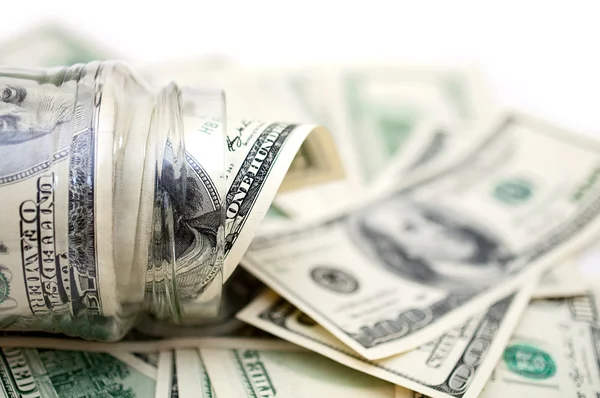 Dólares en frasco de dinero — Foto de Stock