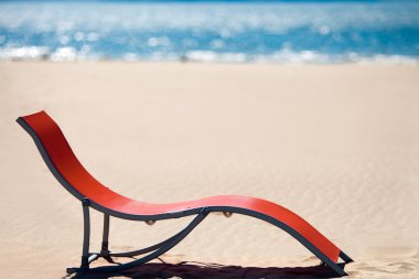 Beach chair on idyllic tropical sand beach. Concept for rest, re clipart