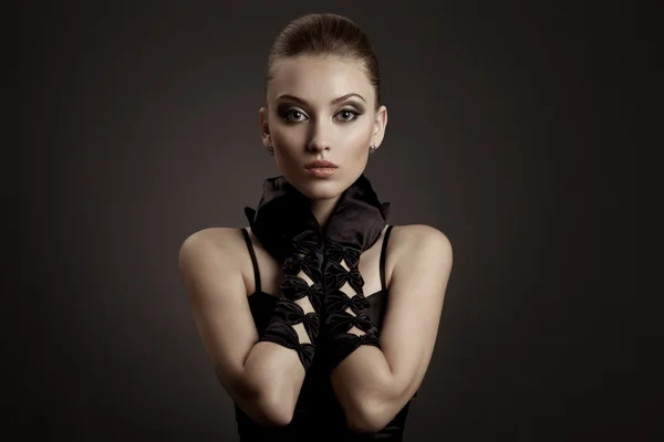 Fashion Portrait of a beautiful woman in black retro gloves — Stock Photo, Image