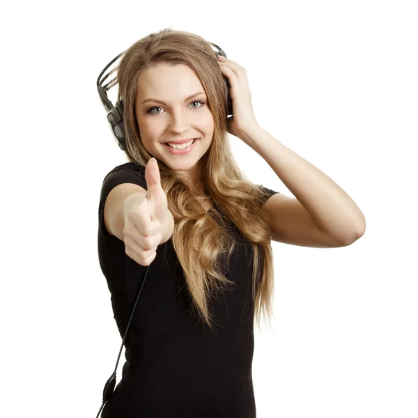 Ελκυστική χαμογελαστό γυναίκα με ακουστικά σε άσπρο φόντο — Φωτογραφία Αρχείου