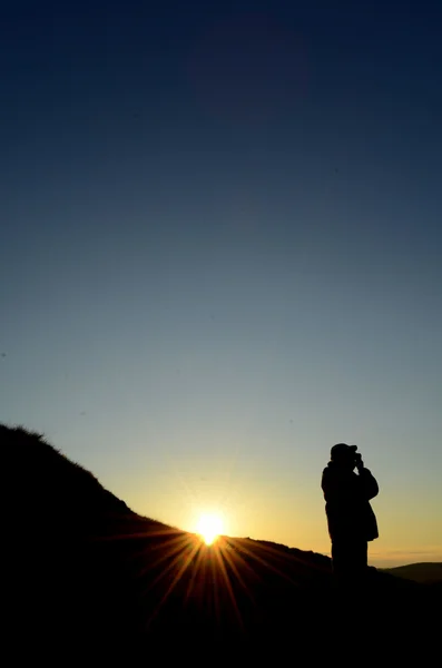 Photographe au coucher du soleil — Photo