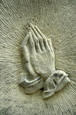 Praying Hands On A Gravestone clipart