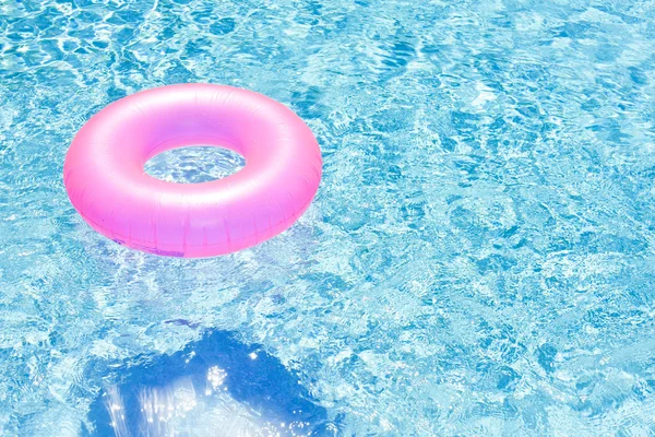 Pink rubber ring in swimming pool — Stock Photo, Image