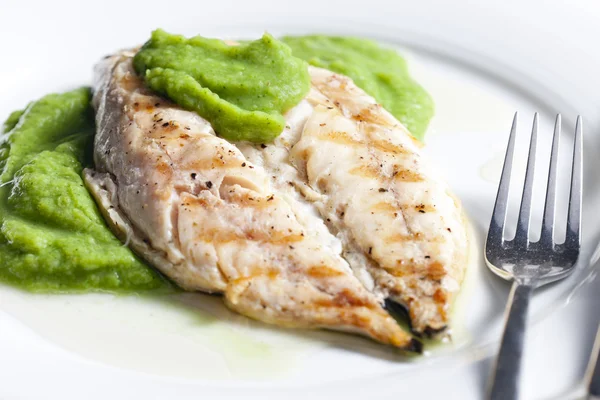 stock image Grilled mackerel with mashed pea and basil