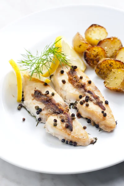 Butterfish baked on pepper and anchovies — Stock Photo, Image
