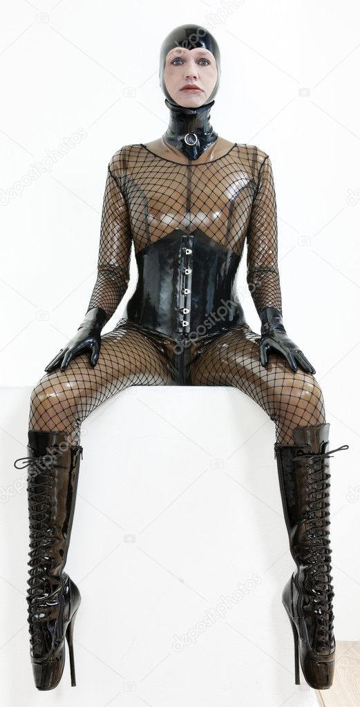 Sitting woman wearing latex clothes