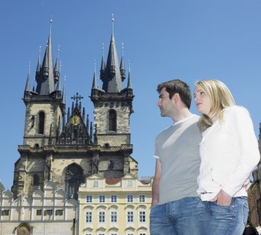 Couple in Prague, Tynsky church, Old Town Square, Czech Republic clipart