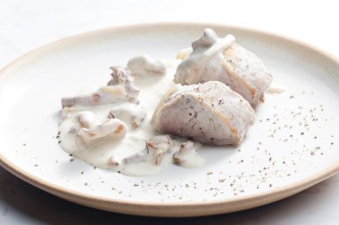 Pork tenderloin with mushrooms and creamy sauce