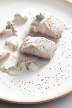 Pork tenderloin with mushrooms and creamy sauce