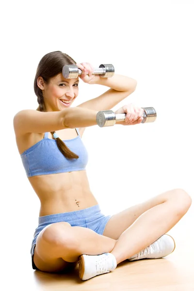 Frau mit stummen Klingeln im Fitnessstudio — Stockfoto