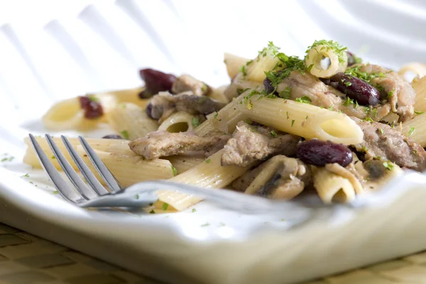 Penne with pork pieces and champignons — Stock Photo, Image