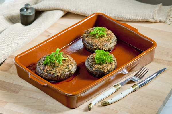 stock image Baked champignons filled with peanuts mixture