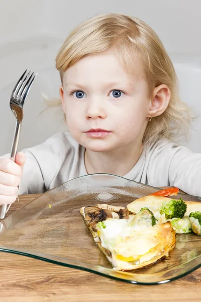 Portrait of little girl eating quesadilla — Stock Photo, Image