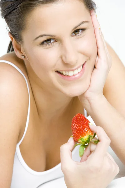 Portrait of woman with a strawberry — Stock Photo, Image