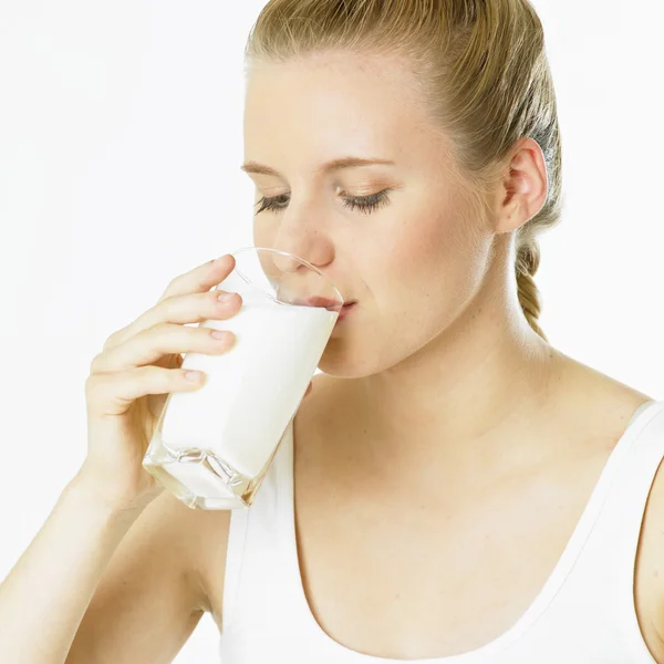 Woman with a glass of milk — Stock Photo, Image