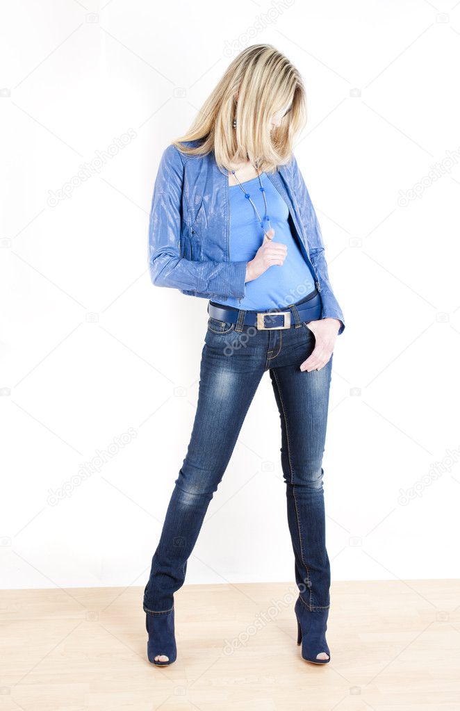 Standing woman wearing blue clothes