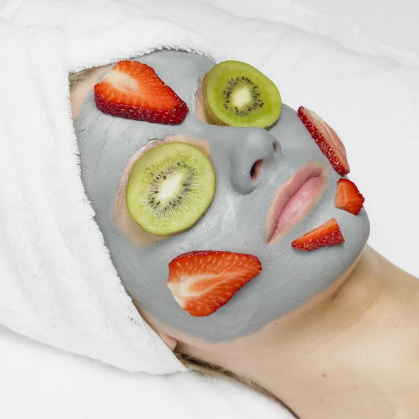Woman with facial mask — Stock Photo, Image