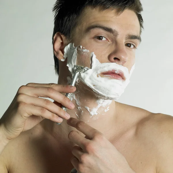Portrait of shaving man Stock Photo