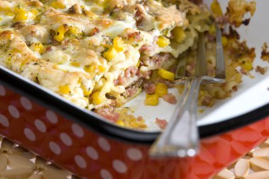 Pasta baked with smoked meat and corn clipart
