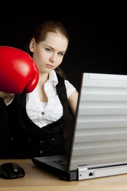 Businesswoman with a notebook and boxing glove clipart