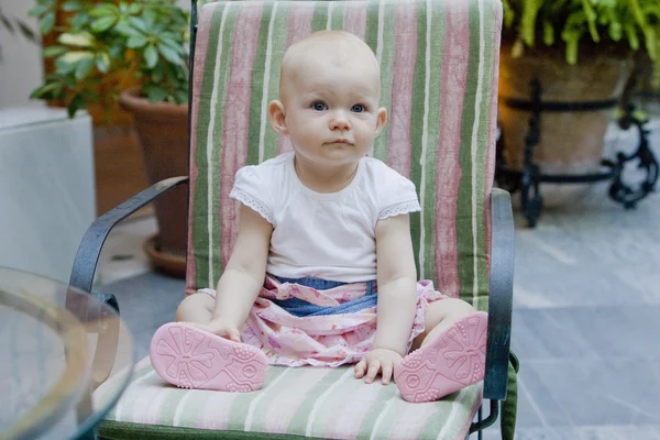 One year old toddler girl sitting on chair — Stock Photo, Image