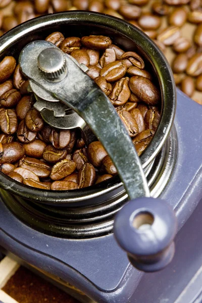 Detail of coffee mill with coffee beans — Stock Photo, Image