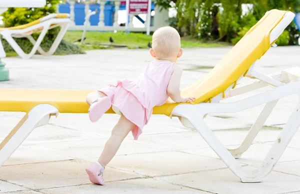 Little girl on beach chair, Tobago — Stock Photo, Image