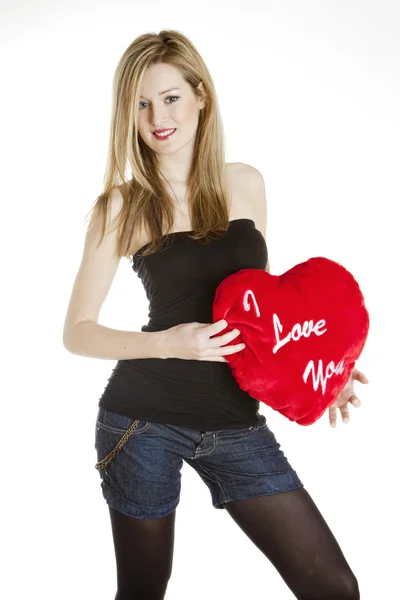 Stojící mladá žena se srdcem — Stock fotografie